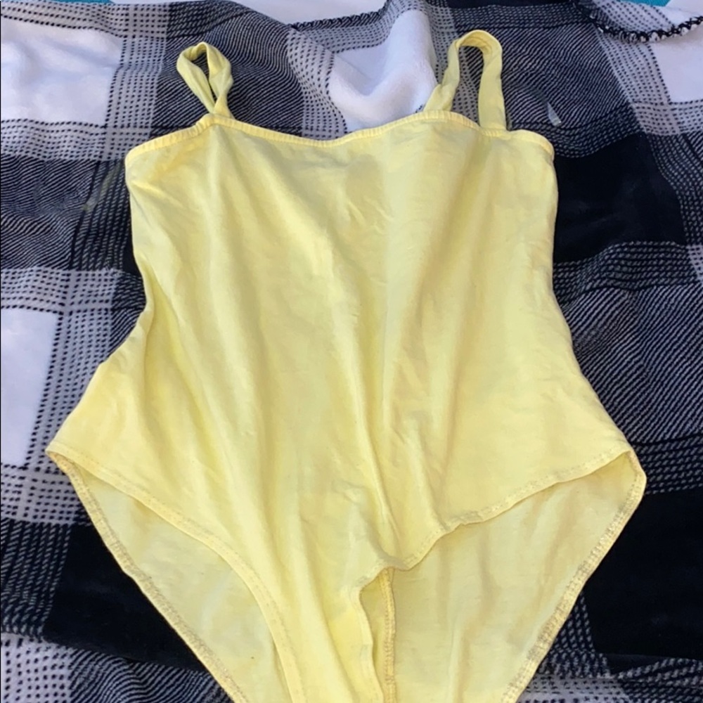 yellow body suit